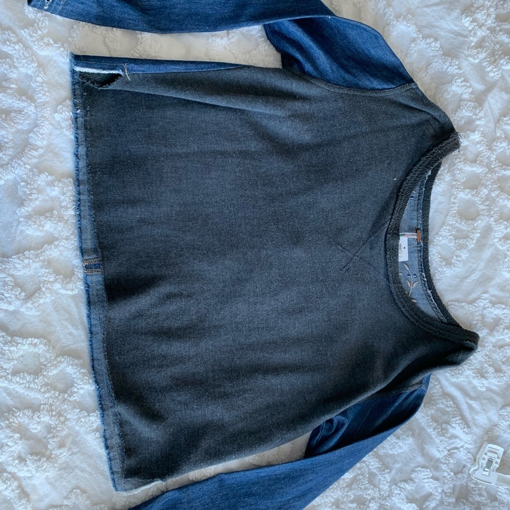 Its a fwo faced top. Unique with embroidery on the back.